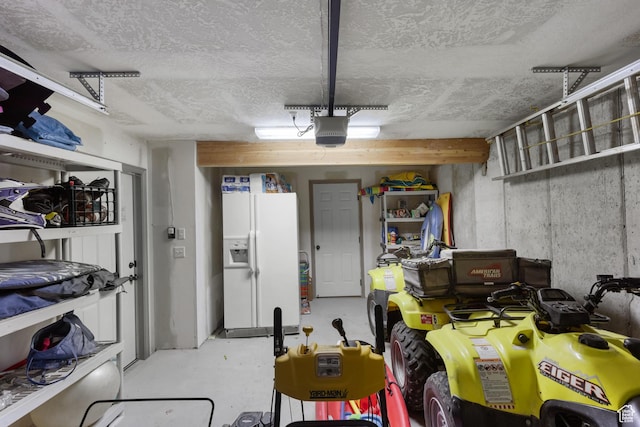1340 N Trapper Loop, Garden City, UT 84028 - garage with white refrigerator with ice dispenser and a garage door opener