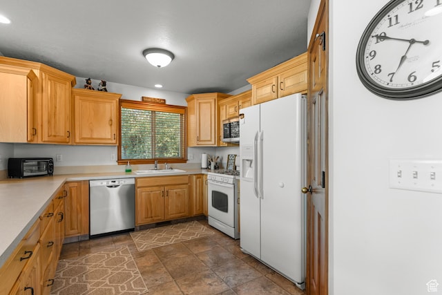 1340 N Trapper Loop, Garden City, UT 84028 - kitchen with stainless steel appliances, light countertops, dark stone finish floors, and recessed lighting