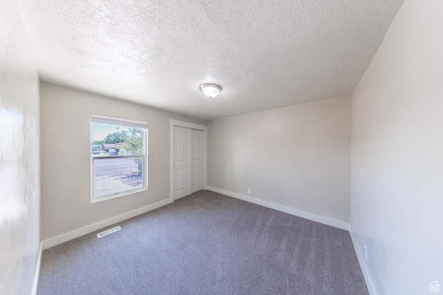 774 W 4375 S, Riverdale, UT 84405 - carpeted spare room with a textured ceiling and baseboards