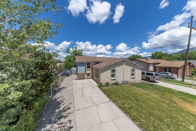 774 W 4375 S, Riverdale, UT 84405 - view of front facade with driveway, a front lawn, and brick siding
