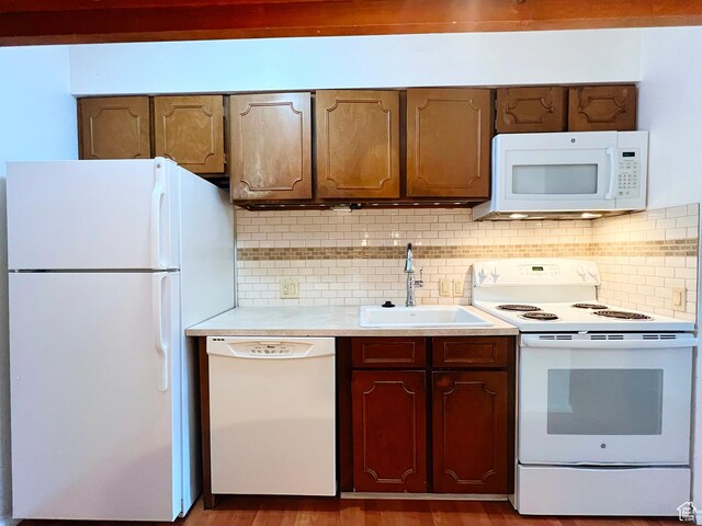 399 W 400 N Unit 47, Bountiful, UT 84010 - kitchen with white appliances, light countertops, tasteful backsplash, and wood finished floors
