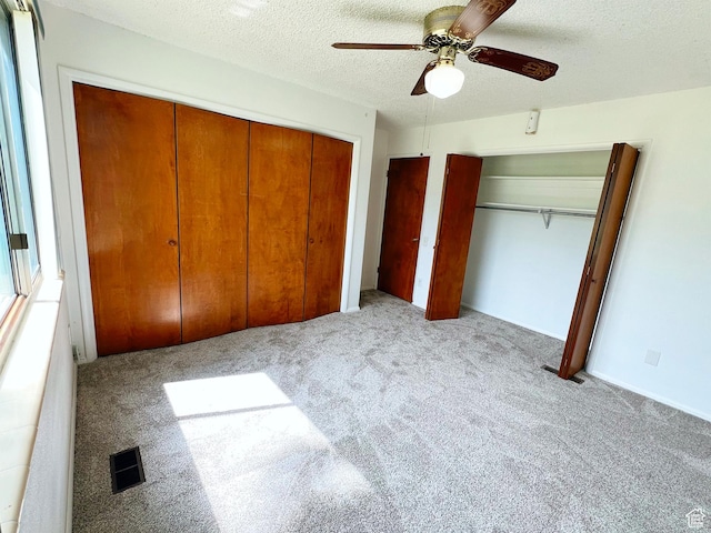 399 W 400 N Unit 47, Bountiful, UT 84010 - unfurnished bedroom featuring carpet, ceiling fan, and a textured ceiling
