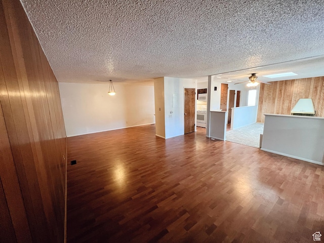 399 W 400 N Unit 47, Bountiful, UT 84010 - unfurnished living room with a textured ceiling, wood finished floors, wood walls, and ceiling fan