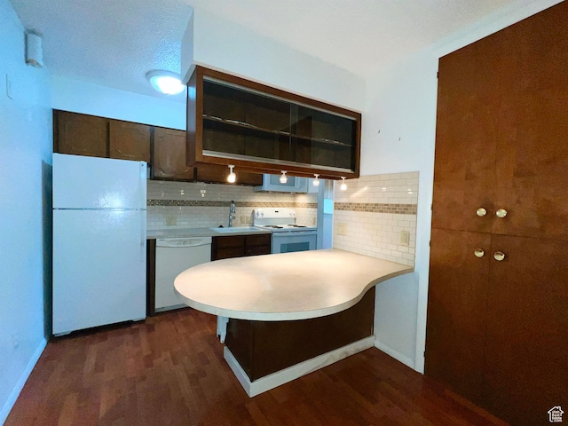 399 W 400 N Unit 47, Bountiful, UT 84010 - kitchen with white appliances, dark wood-type flooring, dark brown cabinets, light countertops, and a peninsula