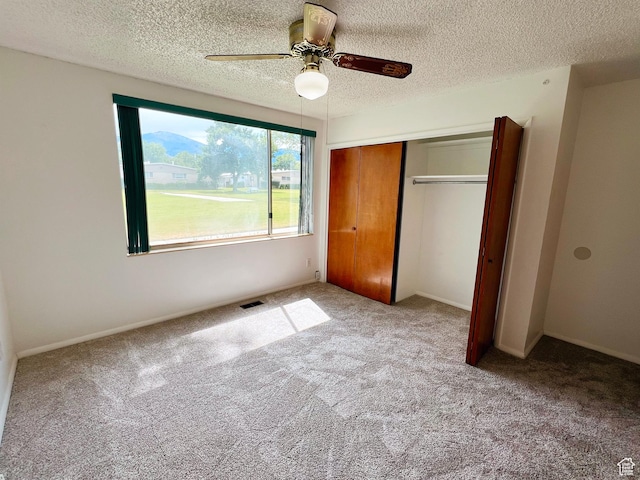 399 W 400 N Unit 47, Bountiful, UT 84010 - unfurnished bedroom with carpet flooring, a closet, a textured ceiling, and ceiling fan