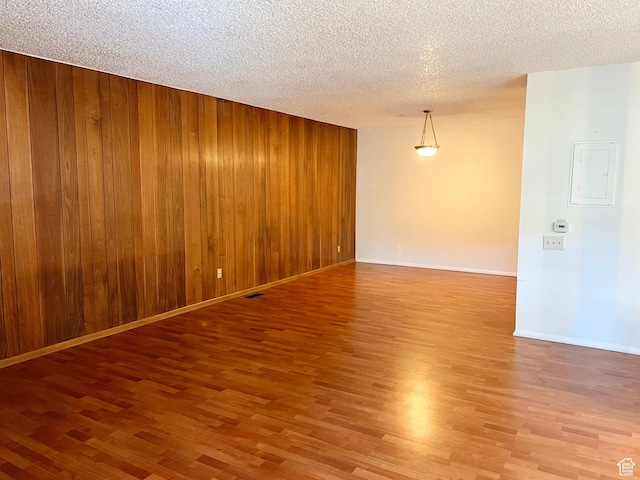 399 W 400 N Unit 47, Bountiful, UT 84010 - spare room featuring wood finished floors, wood walls, and a textured ceiling