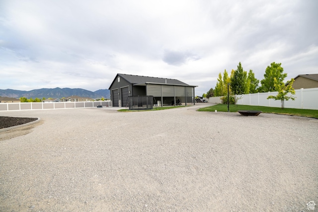 4311 N Diamond Ln, Erda, UT 84074 - view of property exterior with a mountain view and a detached garage