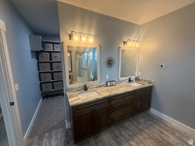 4311 N Diamond Ln, Erda, UT 84074 - full bath with wood finished floors, double vanity, and a shower with door