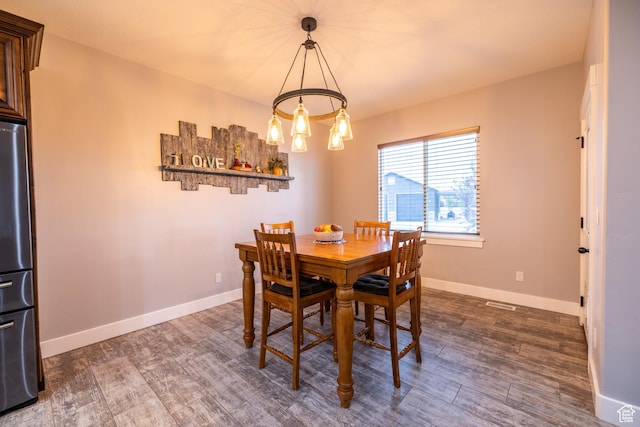 4311 N Diamond Ln, Erda, UT 84074 - dining room with a chandelier and dark wood-style flooring