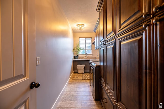 4311 N Diamond Ln, Erda, UT 84074 - kitchen featuring a textured ceiling, wood finished floors, and light countertops