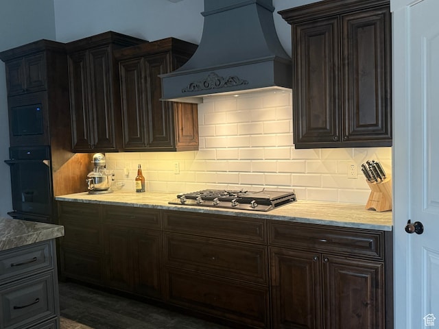 4311 N Diamond Ln, Erda, UT 84074 - kitchen with oven, custom range hood, stainless steel gas cooktop, and decorative backsplash
