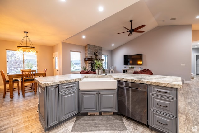 4311 N Diamond Ln, Erda, UT 84074 - kitchen with stainless steel dishwasher, gray cabinetry, a ceiling fan, open floor plan, and lofted ceiling