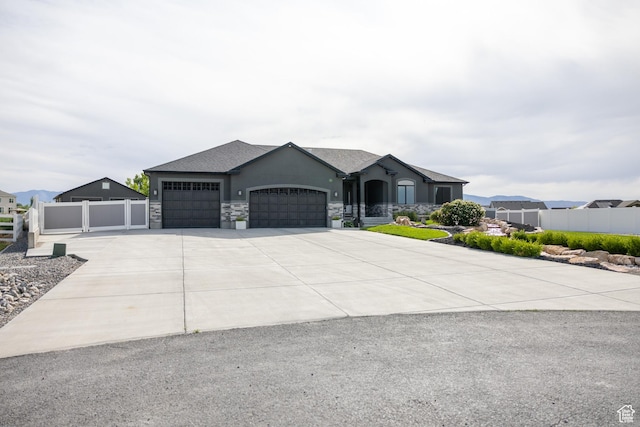 4311 N Diamond Ln, Erda, UT 84074 - french country home with a garage, concrete driveway, and stucco siding