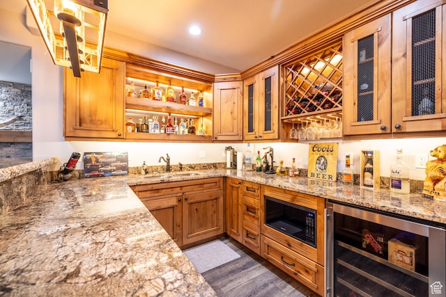 4311 N Diamond Ln, Erda, UT 84074 - indoor wet bar featuring beverage cooler, black microwave, dark wood finished floors, and recessed lighting