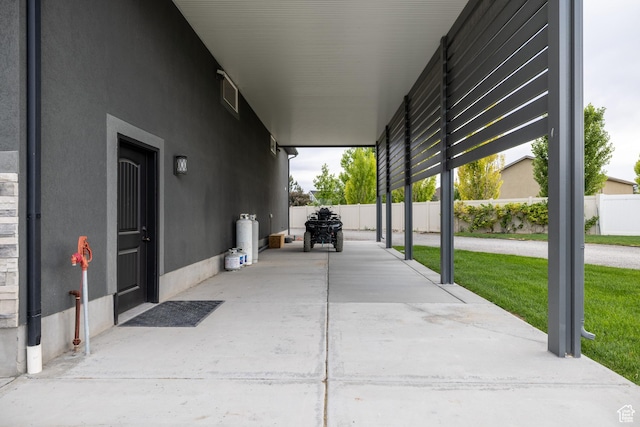 4311 N Diamond Ln, Erda, UT 84074 - view of patio / terrace with a carport and driveway