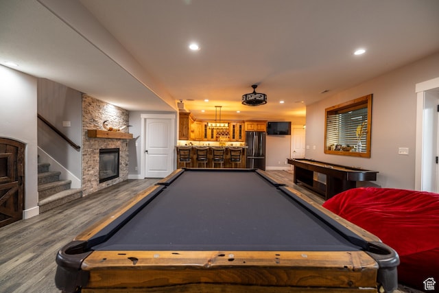 4311 N Diamond Ln, Erda, UT 84074 - rec room with pool table, bar area, dark wood-style flooring, recessed lighting, and a stone fireplace