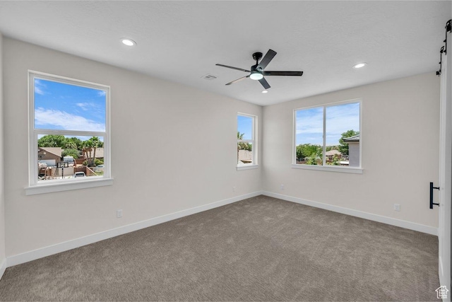 21 W Elinor Ln, Washington, UT 84780 - carpeted empty room with a ceiling fan, recessed lighting, and a barn door