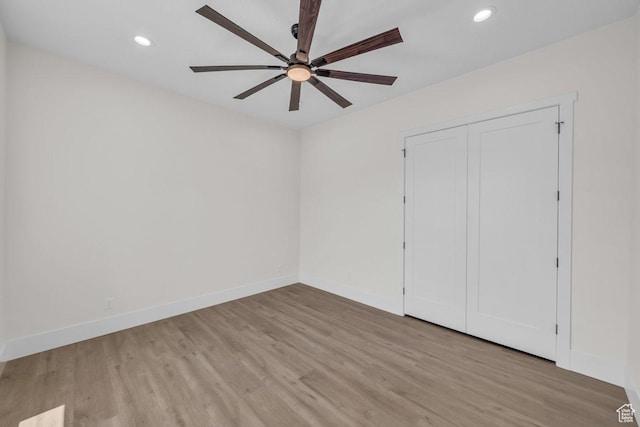 21 W Elinor Ln, Washington, UT 84780 - unfurnished bedroom with wood finished floors, recessed lighting, ceiling fan, and a closet