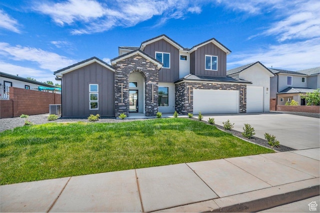 21 W Elinor Ln, Washington, UT 84780 - view of front of property featuring board and batten siding, stone siding, concrete driveway, and a garage