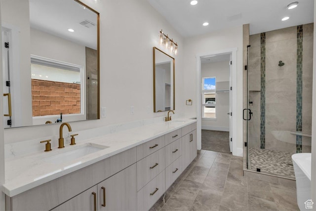 21 W Elinor Ln, Washington, UT 84780 - bathroom with double vanity, a stall shower, a soaking tub, recessed lighting, and marble finish floors