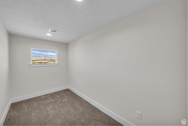 21 W Elinor Ln, Washington, UT 84780 - unfurnished room with dark colored carpet, a textured ceiling, and recessed lighting