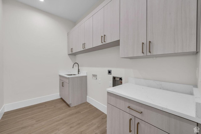21 W Elinor Ln, Washington, UT 84780 - laundry area featuring electric dryer hookup, hookup for a washing machine, light wood finished floors, and cabinet space