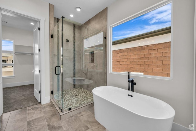 21 W Elinor Ln, Washington, UT 84780 - full bathroom featuring a freestanding tub, a stall shower, and recessed lighting