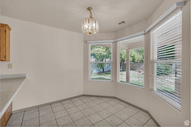 579 E Spring Cir, Washington, UT 84780 - unfurnished dining area featuring a chandelier, healthy amount of natural light, and light tile patterned floors
