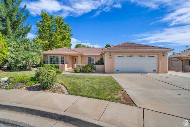 579 E Spring Cir, Washington, UT 84780 - ranch-style home featuring concrete driveway, a garage, stucco siding, and a tiled roof