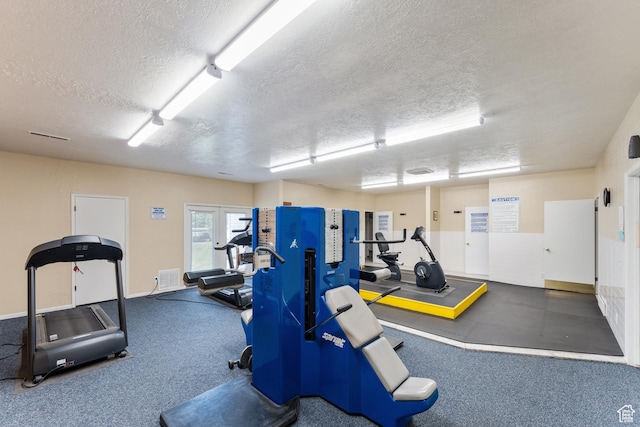 1040 E Quail Park Dr Unit B, Millcreek, UT 84117 - workout area featuring a textured ceiling and baseboards