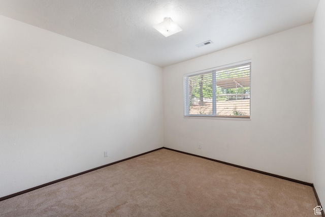 1040 E Quail Park Dr Unit B, Millcreek, UT 84117 - carpeted empty room featuring baseboards