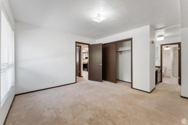 1040 E Quail Park Dr Unit B, Millcreek, UT 84117 - unfurnished bedroom with light carpet, a closet, and connected bathroom