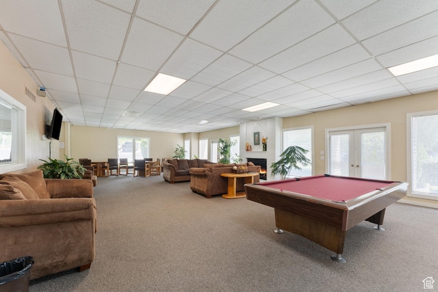 1040 E Quail Park Dr Unit B, Millcreek, UT 84117 - rec room featuring carpet flooring, a paneled ceiling, billiards, french doors, and a warm lit fireplace