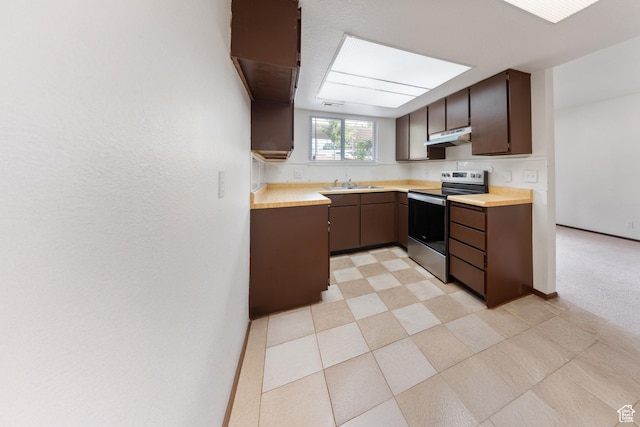 1040 E Quail Park Dr Unit B, Millcreek, UT 84117 - kitchen featuring stainless steel electric range, under cabinet range hood, dark brown cabinets, and butcher block countertops