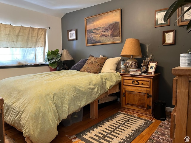 102 N 300 E, Moab, UT 84532 - bedroom with wood finished floors and vaulted ceiling