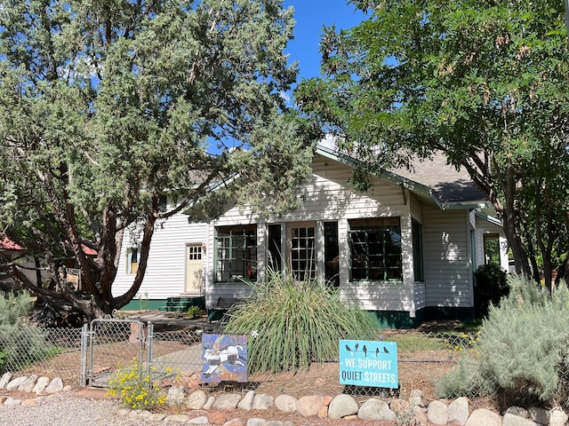 102 N 300 E, Moab, UT 84532 - view of property hidden behind natural elements featuring a gate