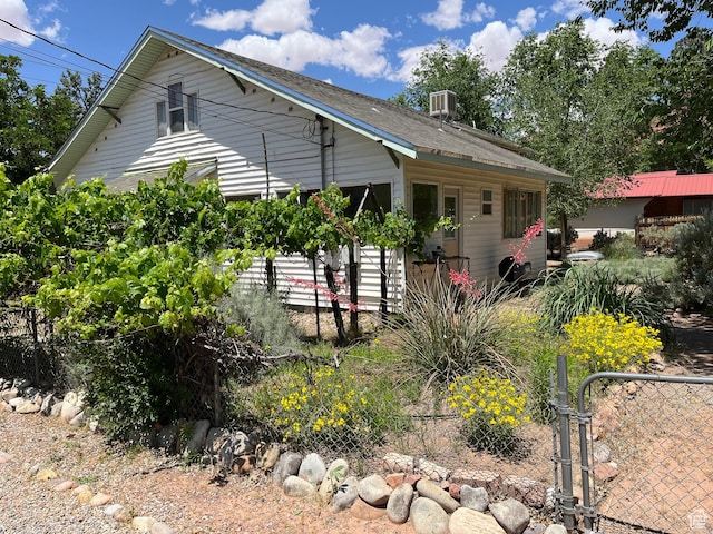 102 N 300 E, Moab, UT 84532 - rear view of house featuring a gate and a shingled roof