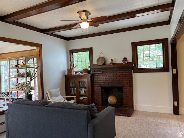 102 N 300 E, Moab, UT 84532 - carpeted living room featuring healthy amount of natural light, a ceiling fan, a brick fireplace, beam ceiling, and a baseboard heating unit