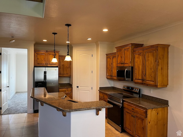 933 N 900 W, Orem, UT 84057 - kitchen with appliances with stainless steel finishes, brown cabinetry, a kitchen bar, ornamental molding, and light tile patterned floors