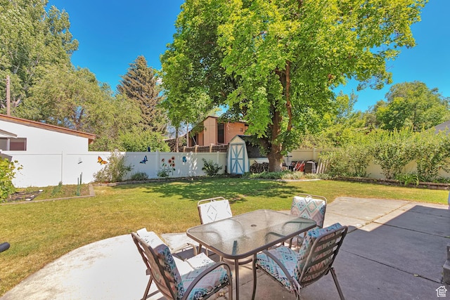 290 N 300 W, Logan, UT 84321 - fenced backyard with a shed, a patio, and outdoor dining area