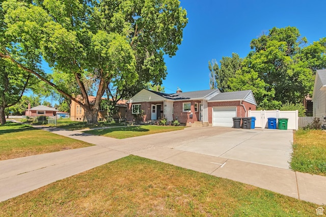 290 N 300 W, Logan, UT 84321 - ranch-style home featuring a garage, brick siding, driveway, and a chimney