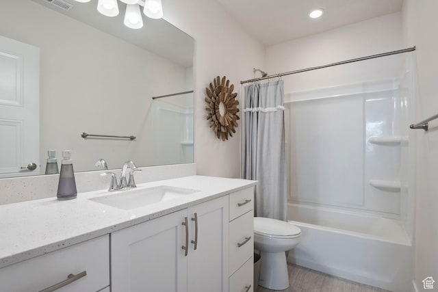 1304 E Weyburn Ln S Unit 10, Holladay, UT 84117 - bathroom featuring vanity, shower / bathtub combination with curtain, wood finished floors, and recessed lighting