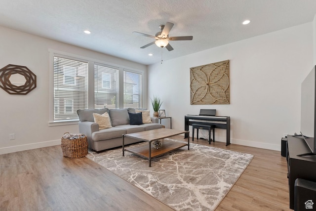 1304 E Weyburn Ln S Unit 10, Holladay, UT 84117 - living area featuring ceiling fan, light wood-style flooring, a textured ceiling, and recessed lighting