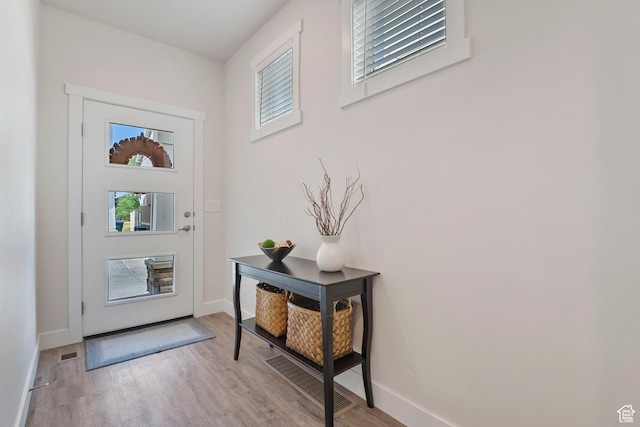 1304 E Weyburn Ln S Unit 10, Holladay, UT 84117 - entrance foyer featuring wood finished floors and plenty of natural light