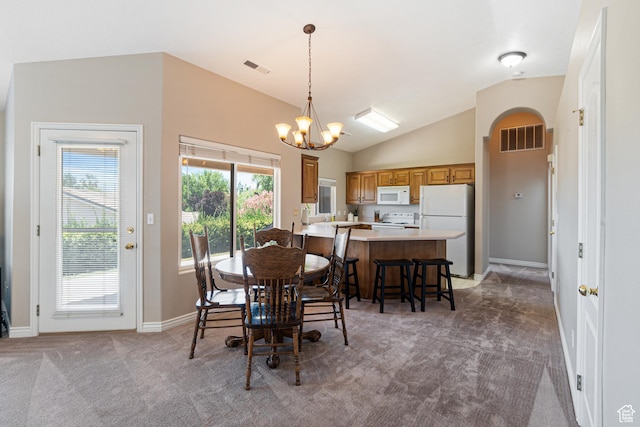 187 N Westridge Dr Unit 155, St George, UT 84770 - dining space with light carpet, a chandelier, and vaulted ceiling