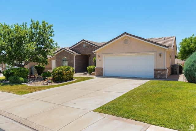 187 N Westridge Dr Unit 155, St George, UT 84770 - single story home with brick siding, a garage, concrete driveway, a front lawn, and stucco siding