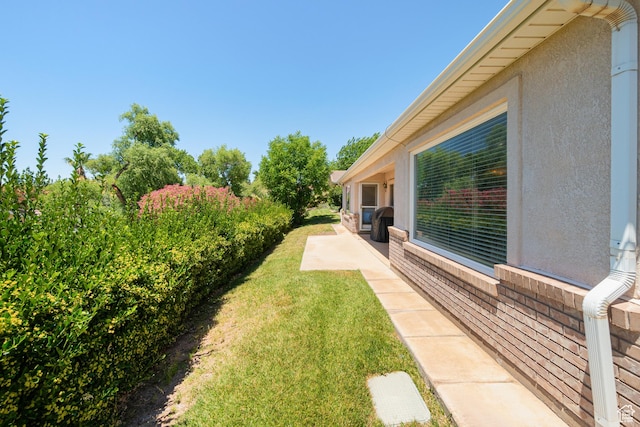 187 N Westridge Dr Unit 155, St George, UT 84770 - view of green lawn with a patio area