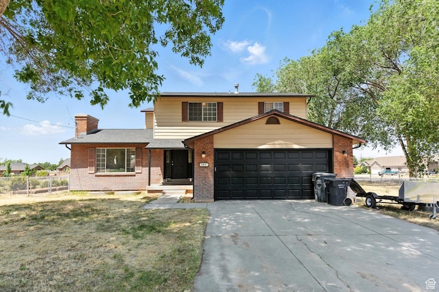 585 N 700 E, Nephi, UT 84648 - traditional-style home featuring brick siding, an attached garage, driveway, and a chimney