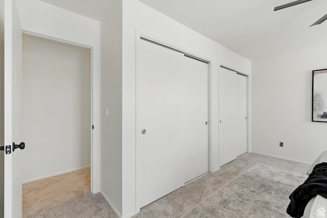 585 N 700 E, Nephi, UT 84648 - bedroom with light colored carpet, multiple closets, and ceiling fan