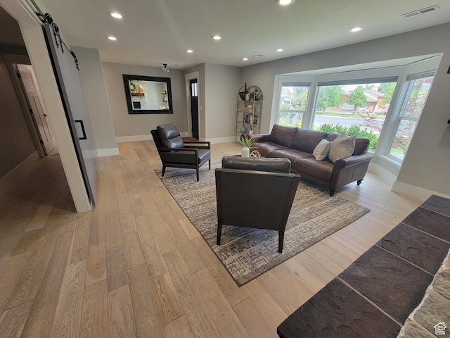 298 E 400 S, Orem, UT 84058 - living area with a barn door, recessed lighting, and light wood-style floors